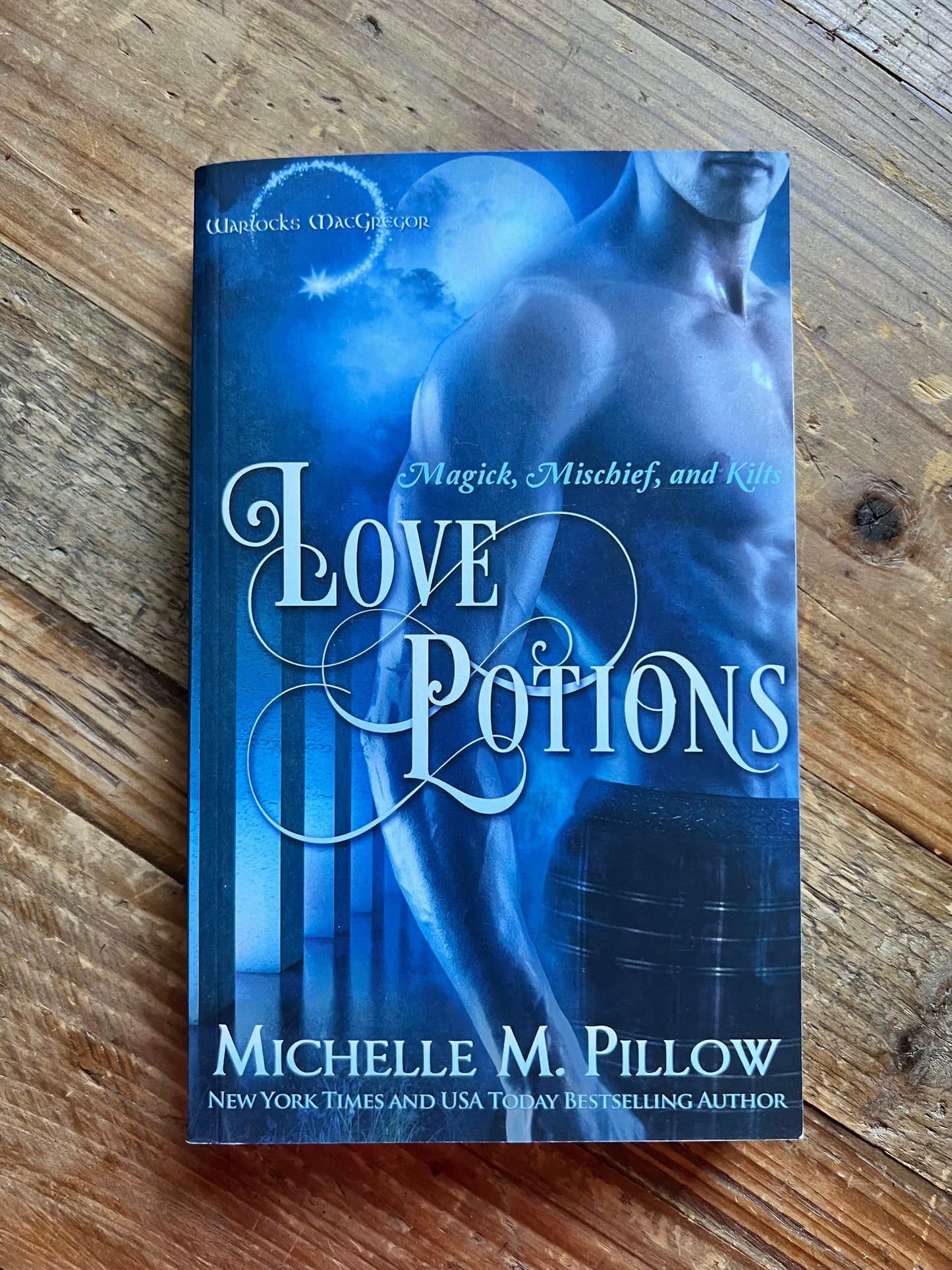  Love Potions paperback on a table.