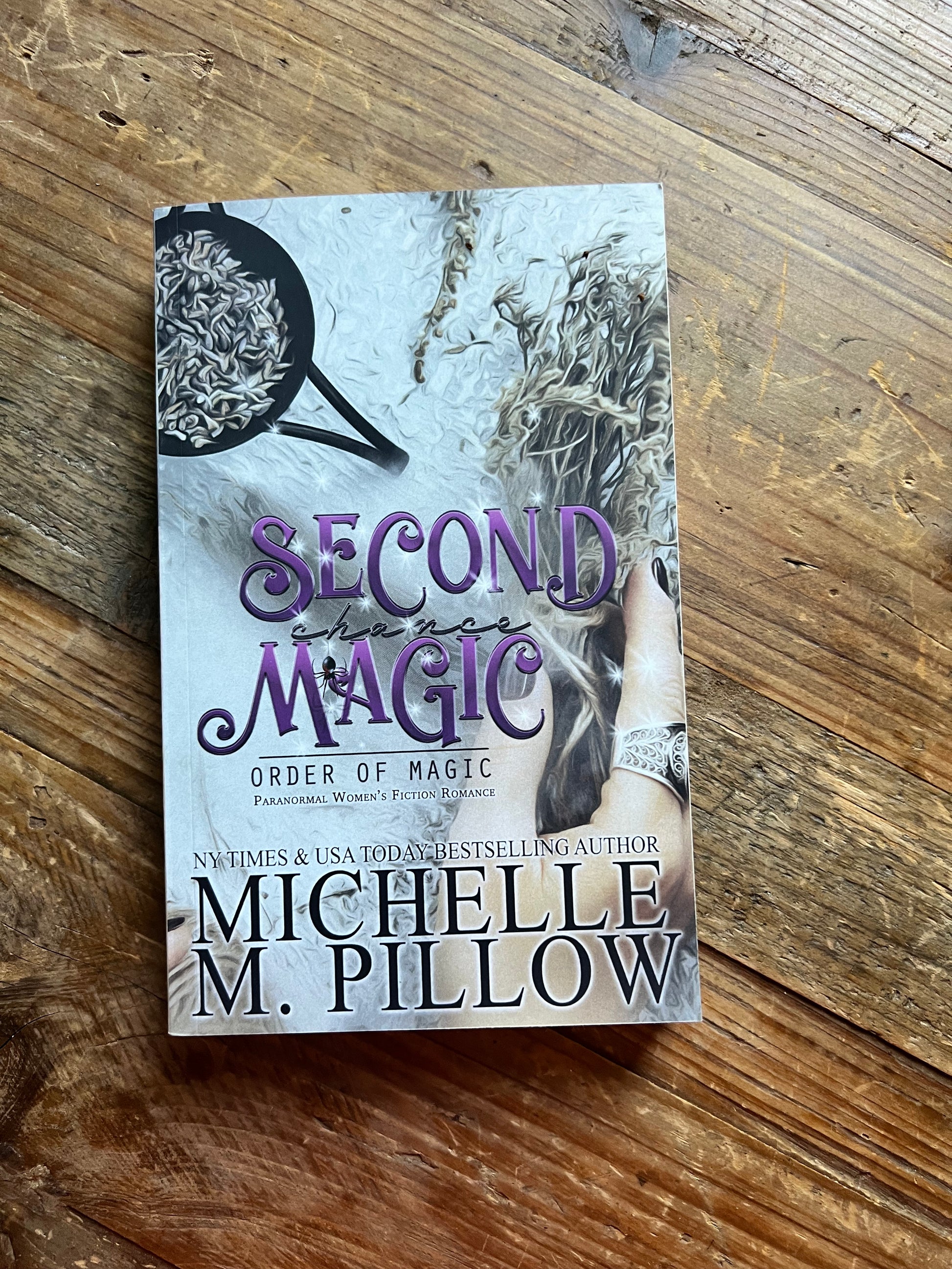 Second Chance Magic paperback on a table top.