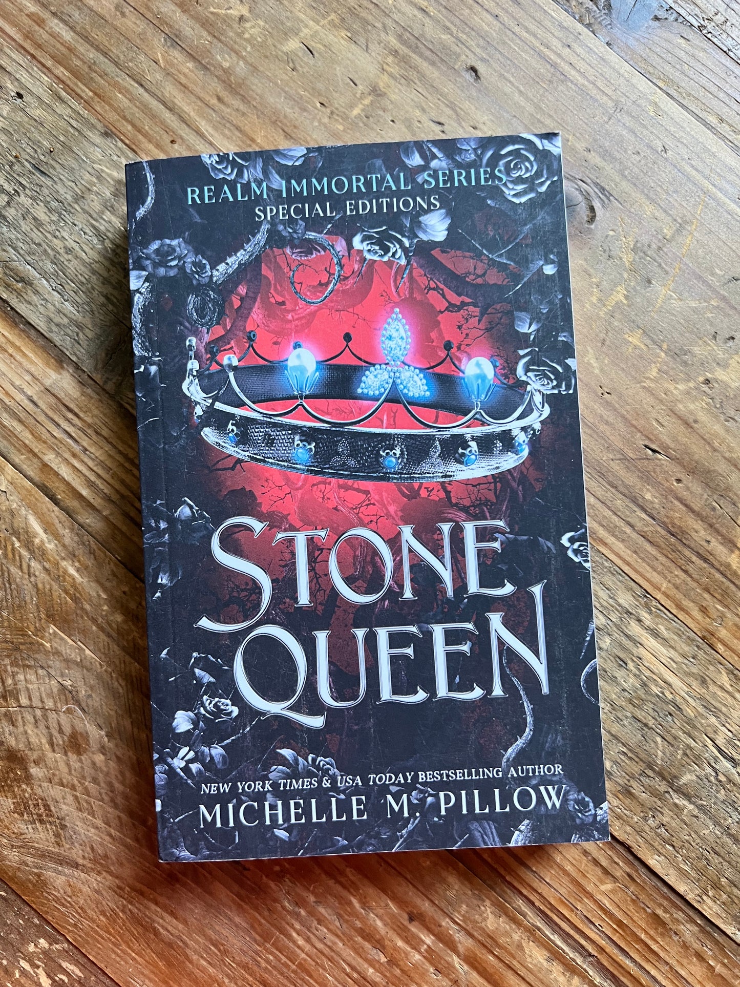 Stone Queen paperback on a table