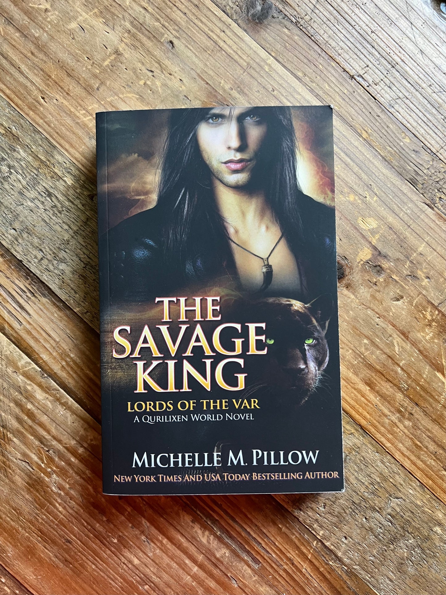 The Savage King paperback on a table.