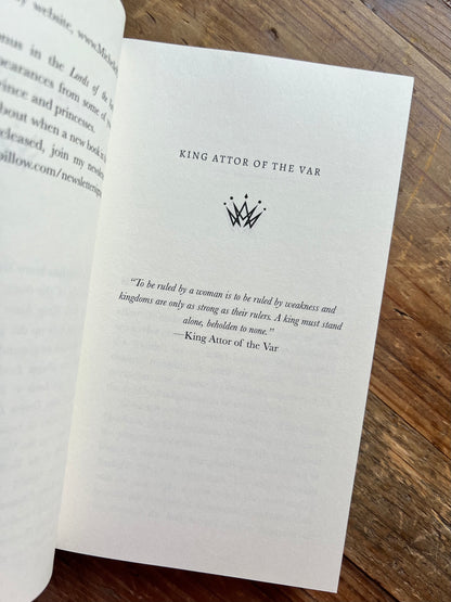 The Savage King paperback inside the book.